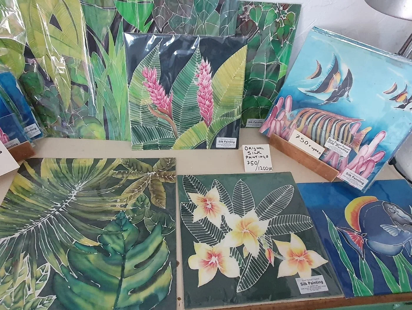 Original hand-painted silk paintings of tropical flowers and reef fish — Andrew Gee gallery at Maison Soleil, Anse Soleil, Seychelles