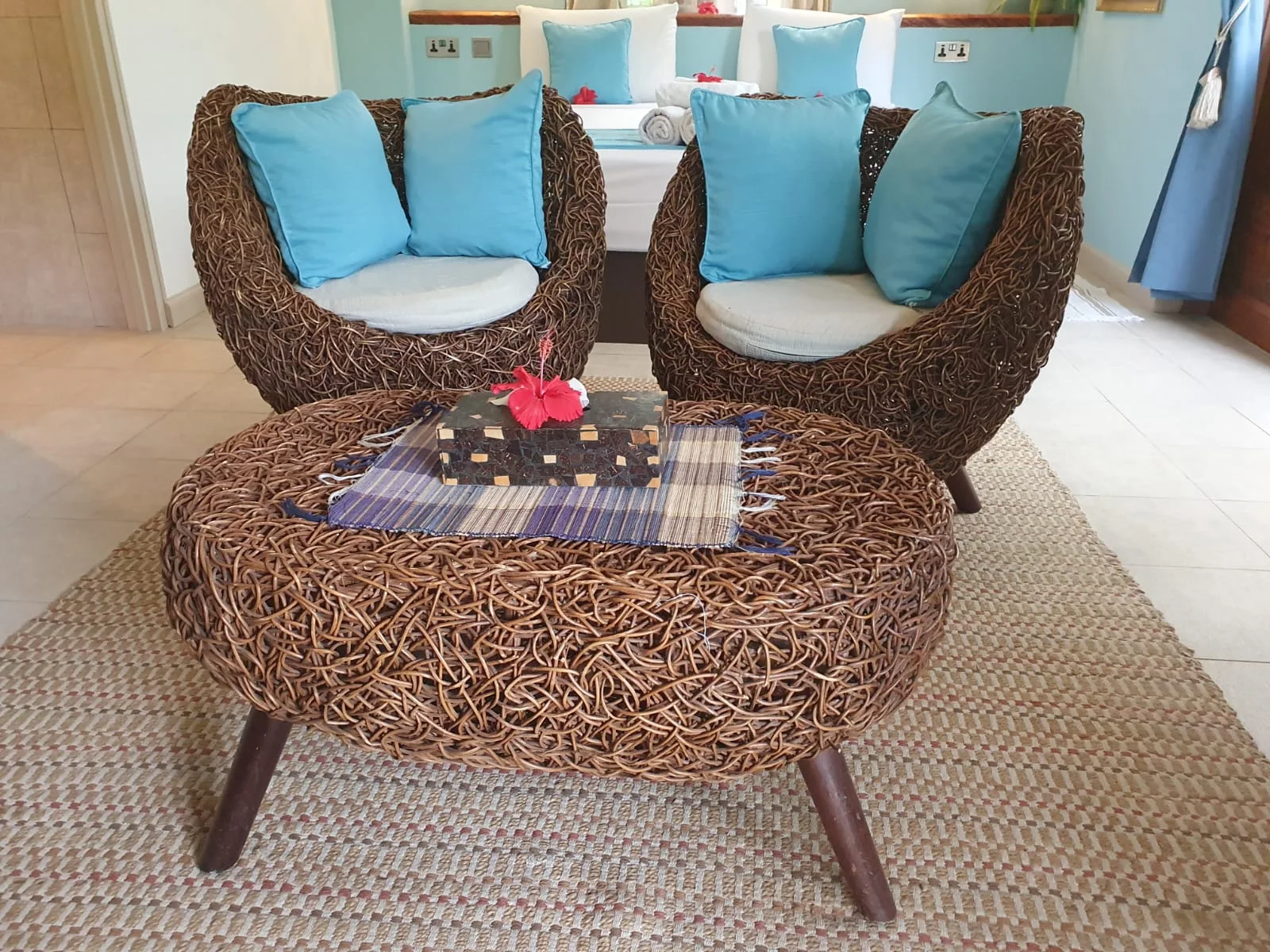 Garden Suite 1 bedroom with glass door opening to private tropical garden views — ground-floor suite at Maison Soleil, Anse Soleil, Seychelles