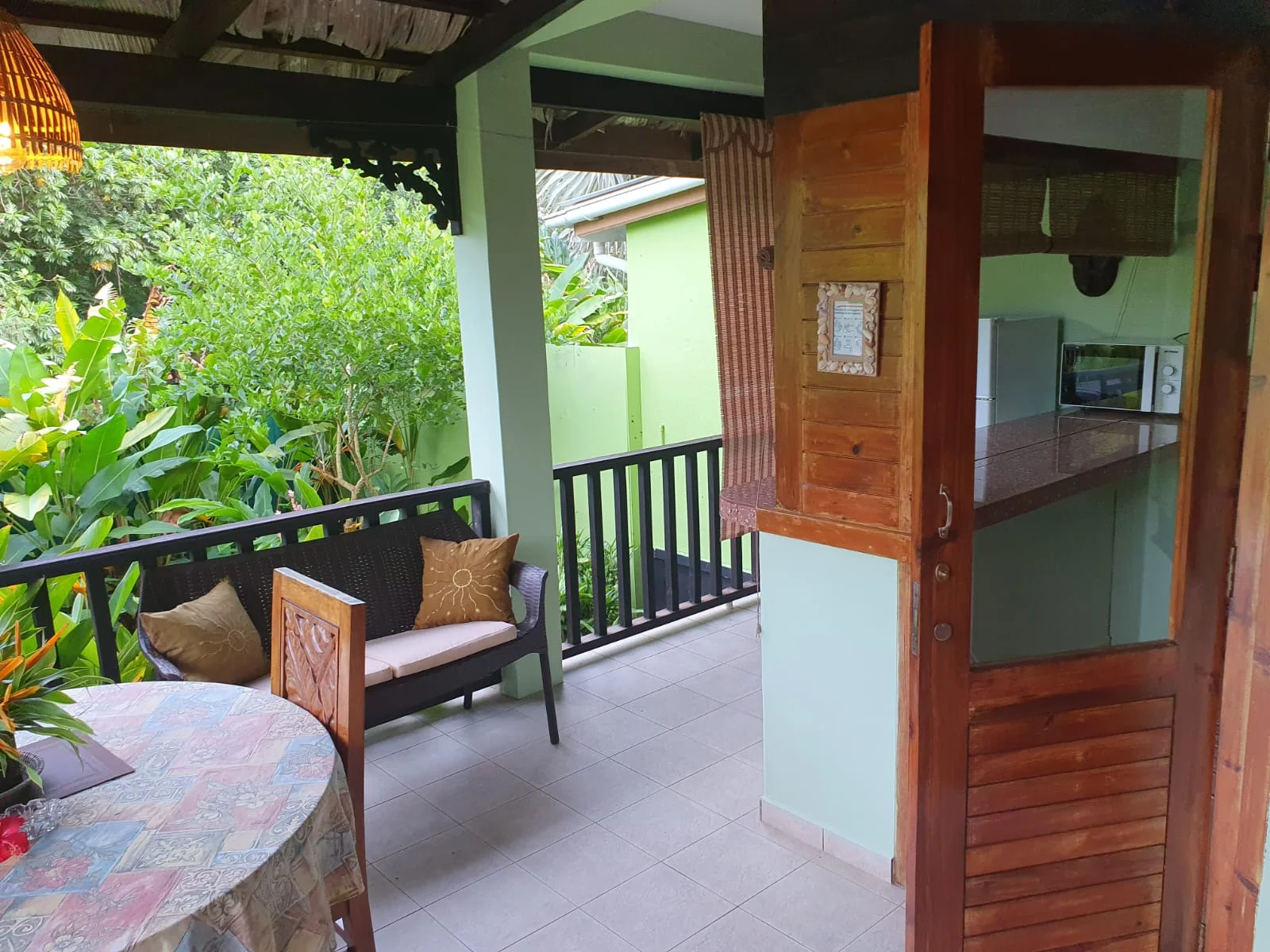 Private outdoor rain shower with bamboo pole privacy screen and tropical planting — Garden Suite 1 walled garden at Maison Soleil, Anse Soleil, Seychelles