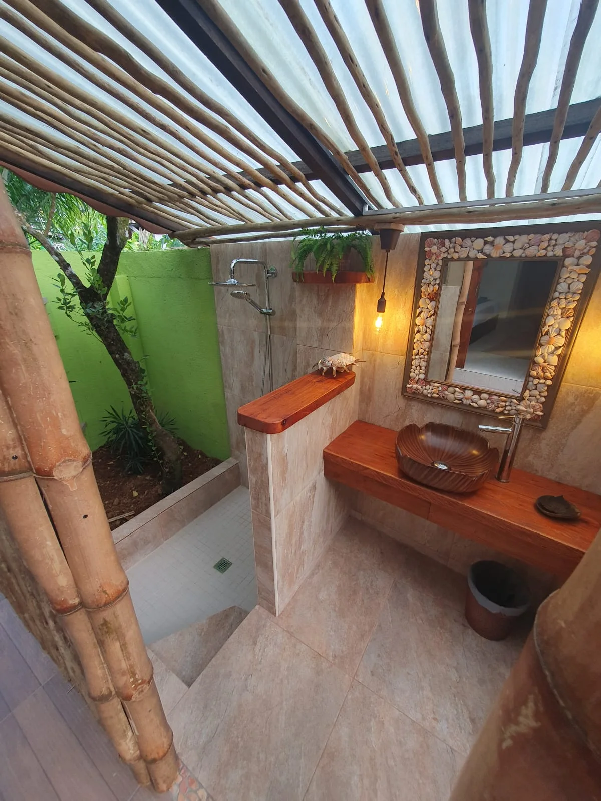 Private arched wooden gate and stone path leading into Maison Soleil gardens — Garden Suite 1 access at Maison Soleil, Anse Soleil, Seychelles
