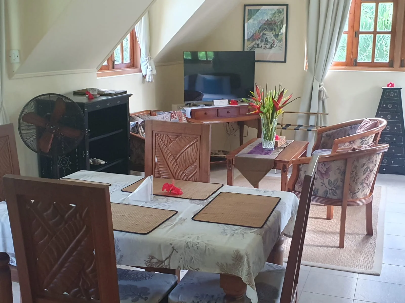 Vanilla Suite living and dining area with tropical furnishings — self-catering suite at Maison Soleil, Anse Soleil, Seychelles
