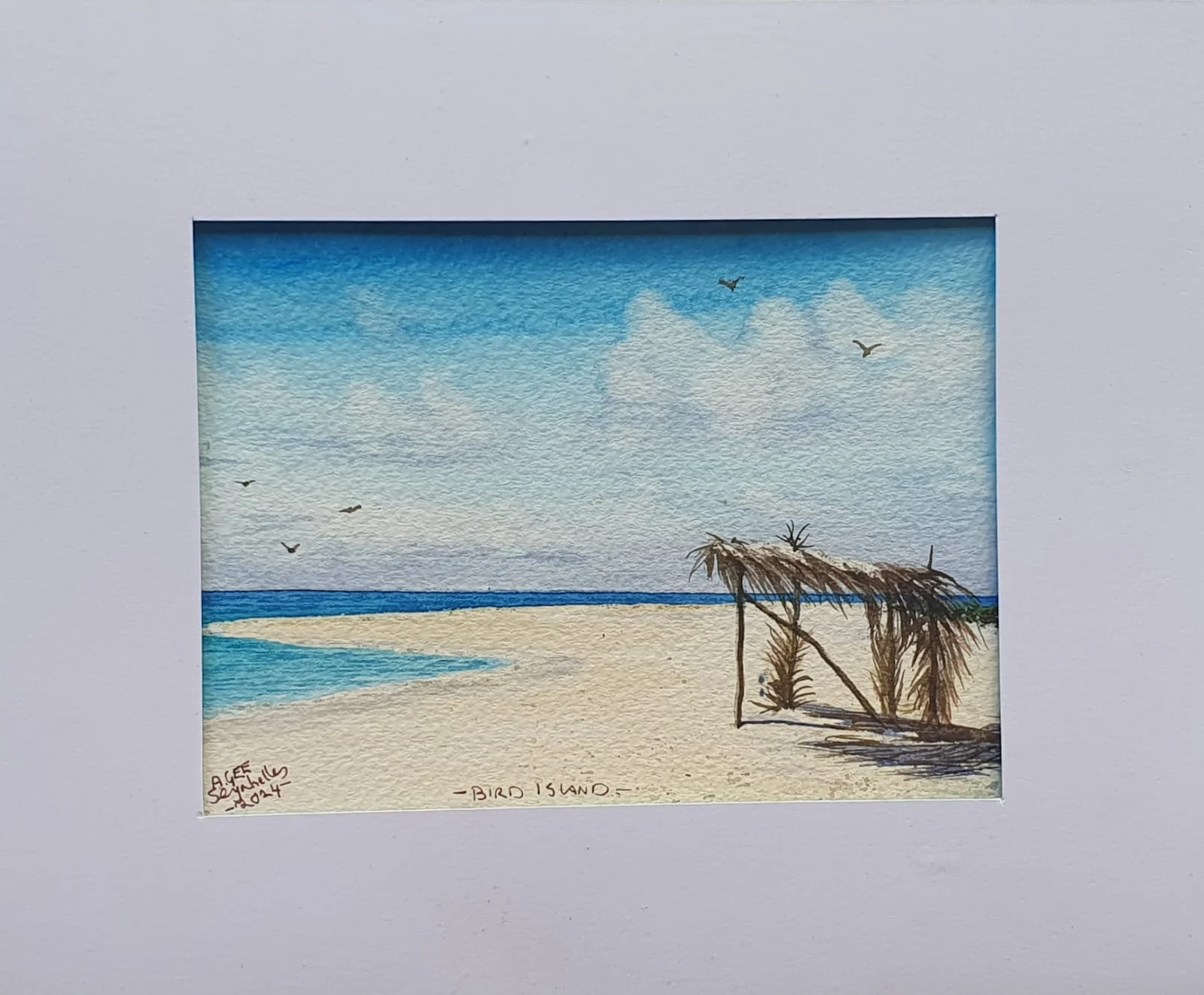 Watercolor of Bird Island beach with thatched shelter and seabirds — original artwork at Anse Soleil Art Studio at Maison Soleil, Anse Soleil, Seychelles (Andrew Gee, Seychelles)