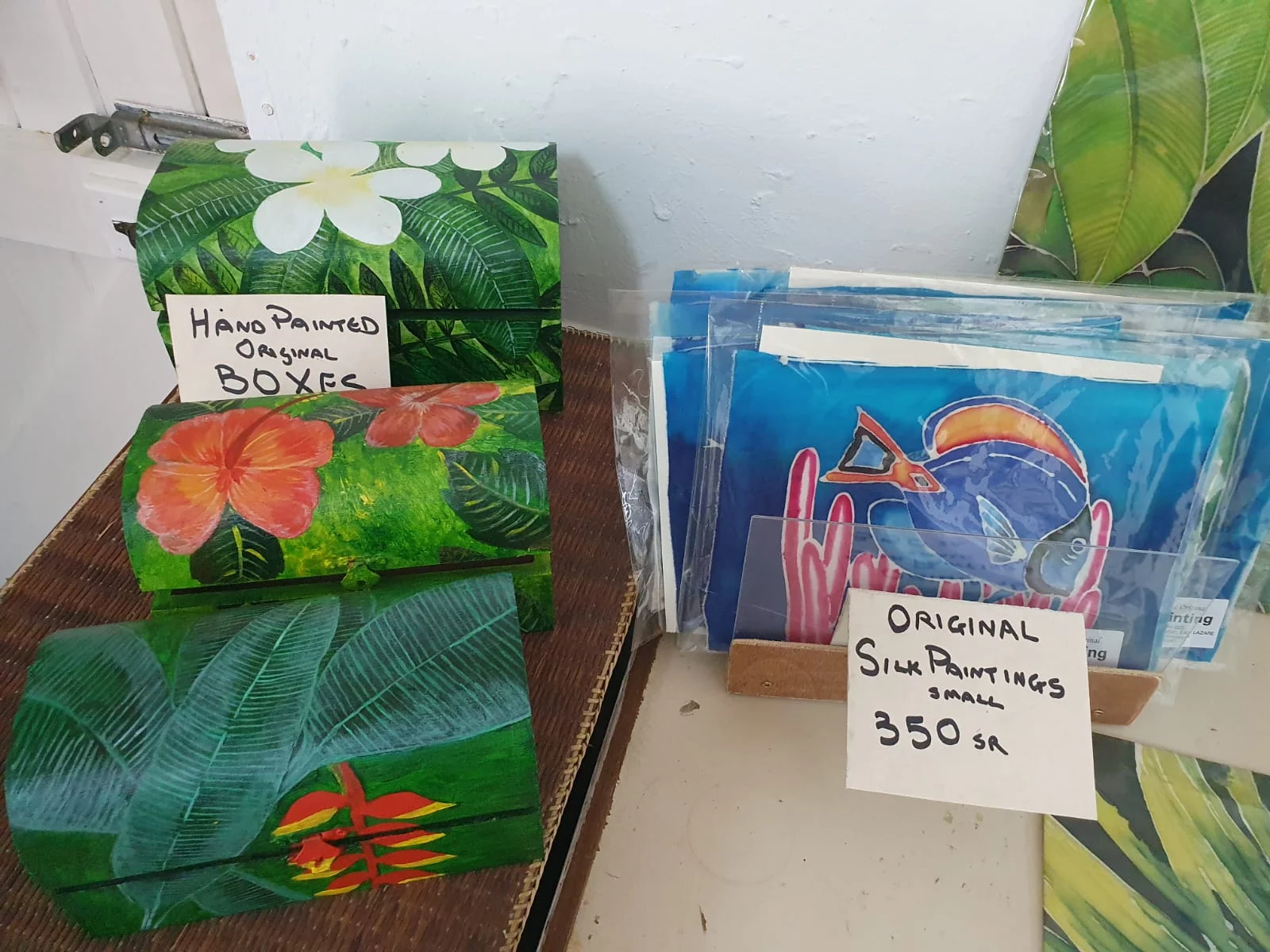 Hand-painted wooden treasure boxes with tropical flowers — original artwork at Anse Soleil Art Studio at Maison Soleil, Anse Soleil, Seychelles (Andrew Gee, Seychelles)