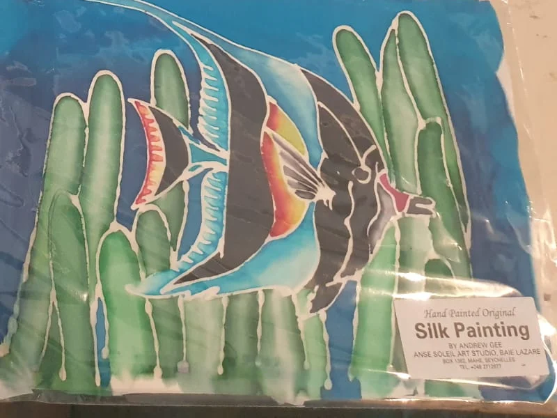 Hand-painted silk painting of two Moorish idol fish in seagrass — original artwork at Anse Soleil Art Studio at Maison Soleil, Anse Soleil, Seychelles (Andrew Gee, Seychelles)