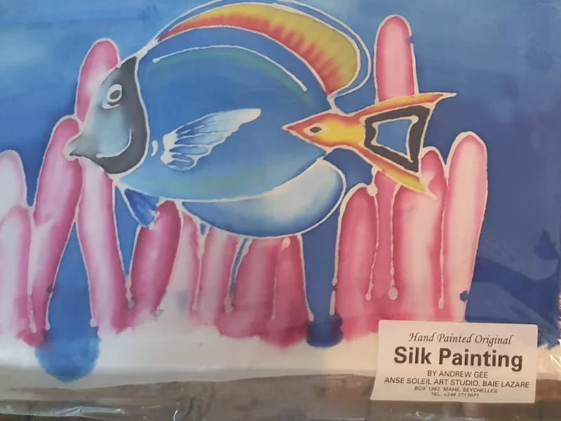 Hand-painted silk painting of a powder blue tang fish — original artwork at Anse Soleil Art Studio at Maison Soleil, Anse Soleil, Seychelles (Andrew Gee, Seychelles)